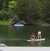 Two girls paddleboarding