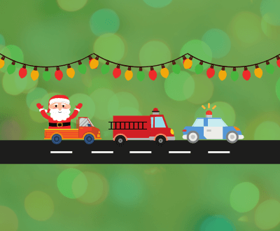 Santa, a Fire Truck, and a police car in a parade with Christmas lights.