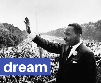 Martin Luther King Jr. waving at crowd at Washington Monument