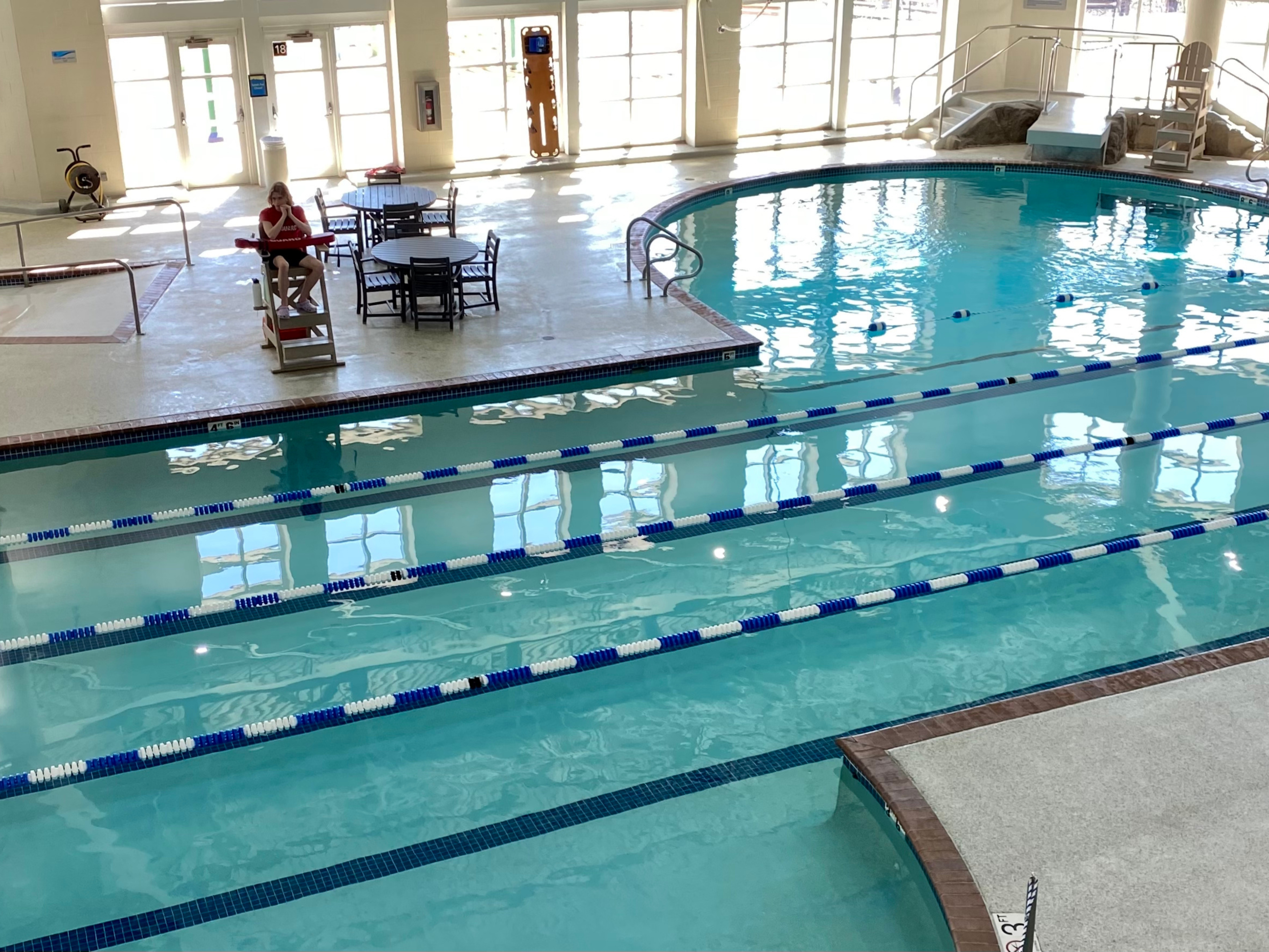 4 pool Lap lanes with windows and lifeguard in the background